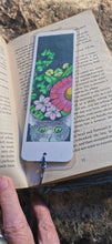 Printed, laminated bookmark, book mark, peeping tom cat bookmark.