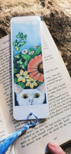 Printed, laminated bookmark, book mark, peeping tom cat bookmark.