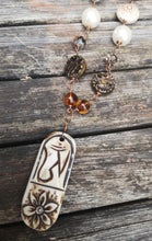 carved bone medallion