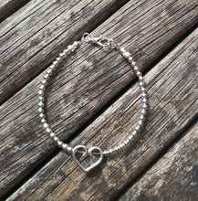 Bellatrix heart charm cosmic bracelet.