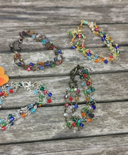 Harlequin: Stunning, hand wired triple stranded Swarovski crystal bracelet in 4 colour choices of metal