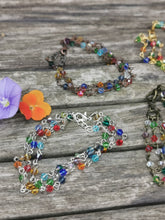 Harlequin: Stunning, hand wired triple stranded Swarovski crystal bracelet in 4 colour choices of metal