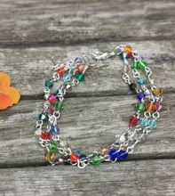 Harlequin: Stunning, hand wired triple stranded Swarovski crystal bracelet in 4 colour choices of metal