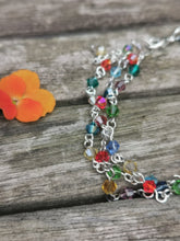 Harlequin: Stunning, hand wired triple stranded Swarovski crystal bracelet in 4 colour choices of metal