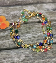 Harlequin: Stunning, hand wired triple stranded Swarovski crystal bracelet in 4 colour choices of metal