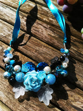 Symphony necklaces: hand wired, necklace with polymer clay roses and flowers