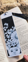 Printed, laminated bookmark, book mark, peeping tom cat bookmark.