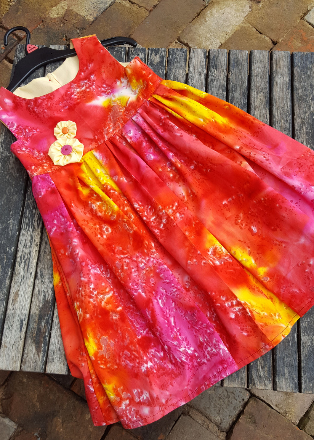 vibrant reds and yellow in this fun sun dress