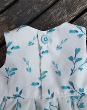 button closure to the back