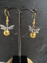 silver winged golden snitch earrings