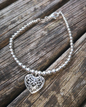 Etamin filigree heart charm bracelet.