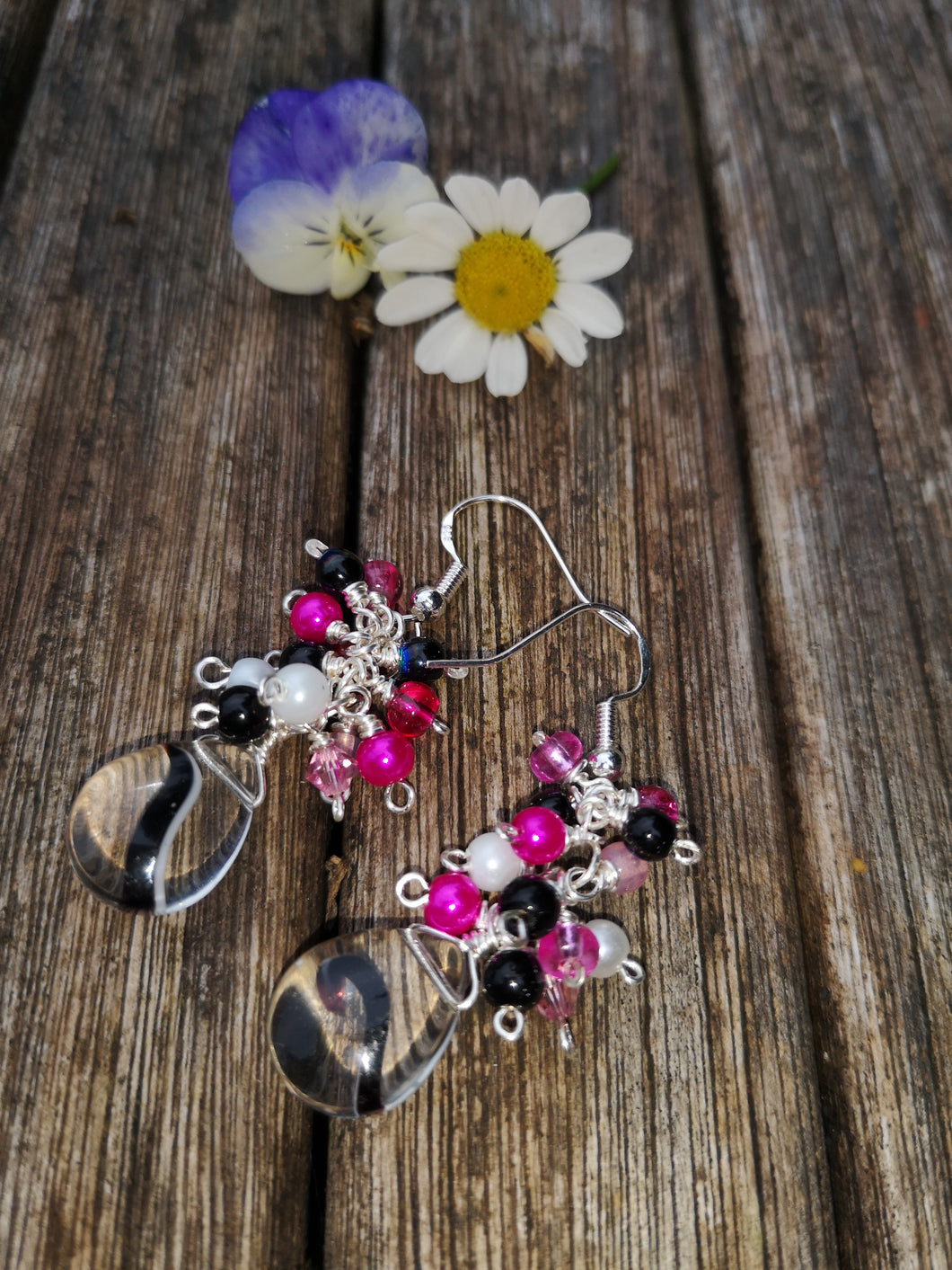 Hot pink cascade earrings with 925 silver earwires and clear swirled pear drops.