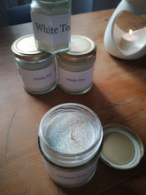 white tea candle with glitter
