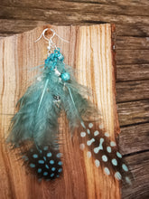 Float on, delicate feathered earrings with crystals and beads,