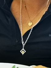 Aragonite fidget necklace worn by R